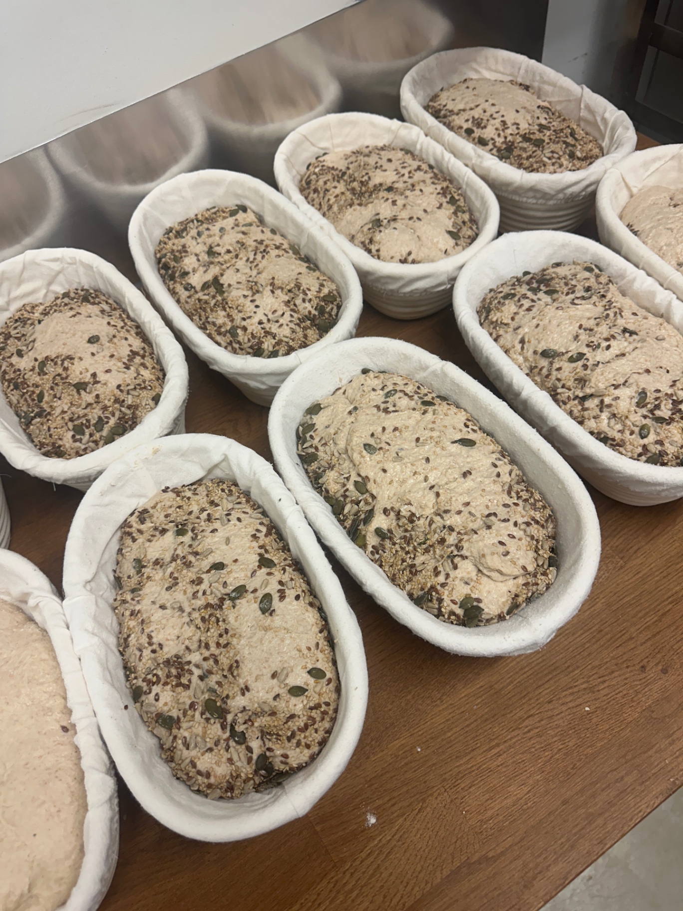Sourdough proofing in linen-lined banneton baskets